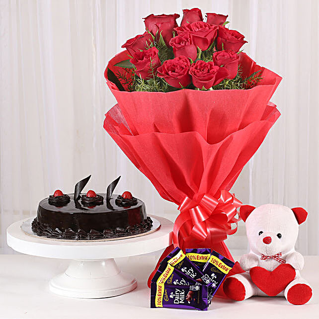 flowers with teddy bear and chocolates